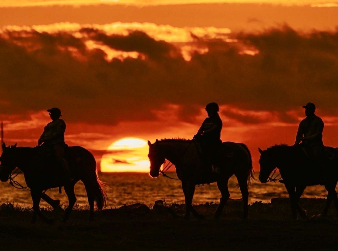 Horseback riders on the westside Kaua‘i coastline at Whoa Dea Ranch